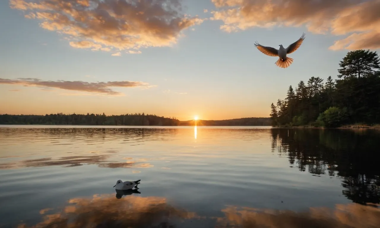 A photo of a serene sunset over a calm lake, with a dove peacefully flying in the foreground, symbolizing Jesus as the Prince of Peace.
