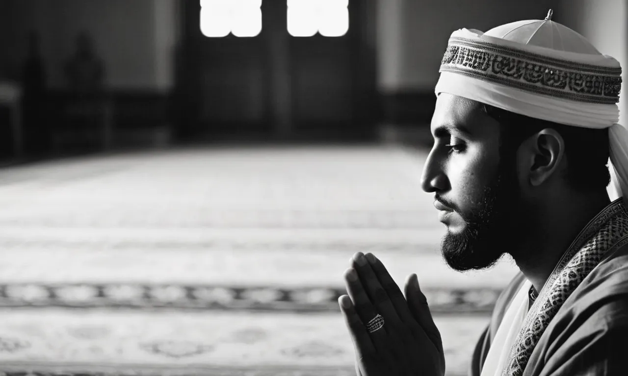 A serene black and white image captures a Muslim in prayer, their face illuminated by a soft light, symbolizing their deep submission and peaceful connection with God.