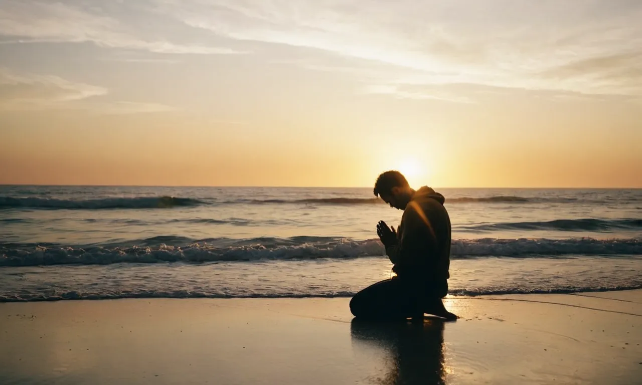 A radiant sunset illuminates a tranquil beach, where a solitary figure kneels in prayer, their silhouette bathed in golden light, a testament to the divine love that awaits those who seek it.