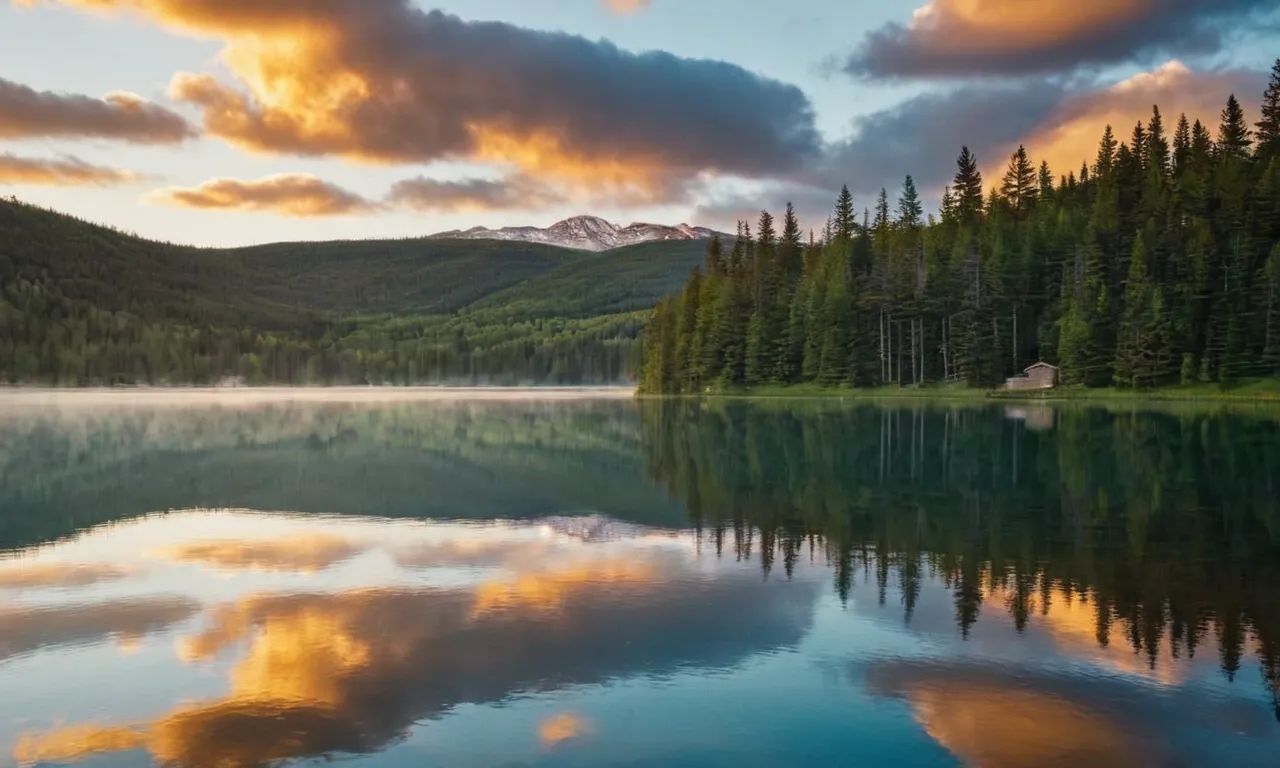 A serene photograph capturing a peaceful sunrise over a serene lake, accompanied by the Bible verse: "He who loves to sleep will become poor; open your eyes, and you will have plenty."