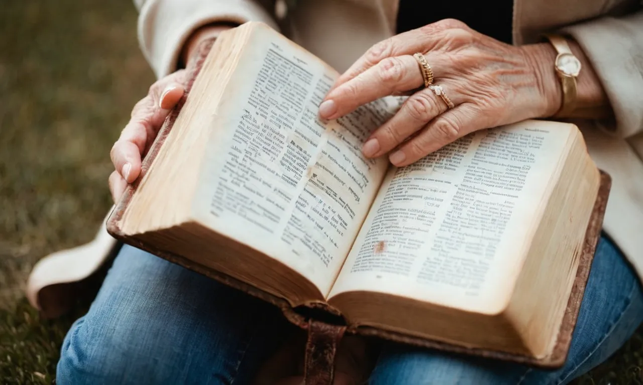 Close-up of Beth Moore holding a well-worn Bible, her weathered hands showcasing a lifetime of devotion. Ageless wisdom emanates from her eyes, reflecting the years spent studying and teaching the Word of God.