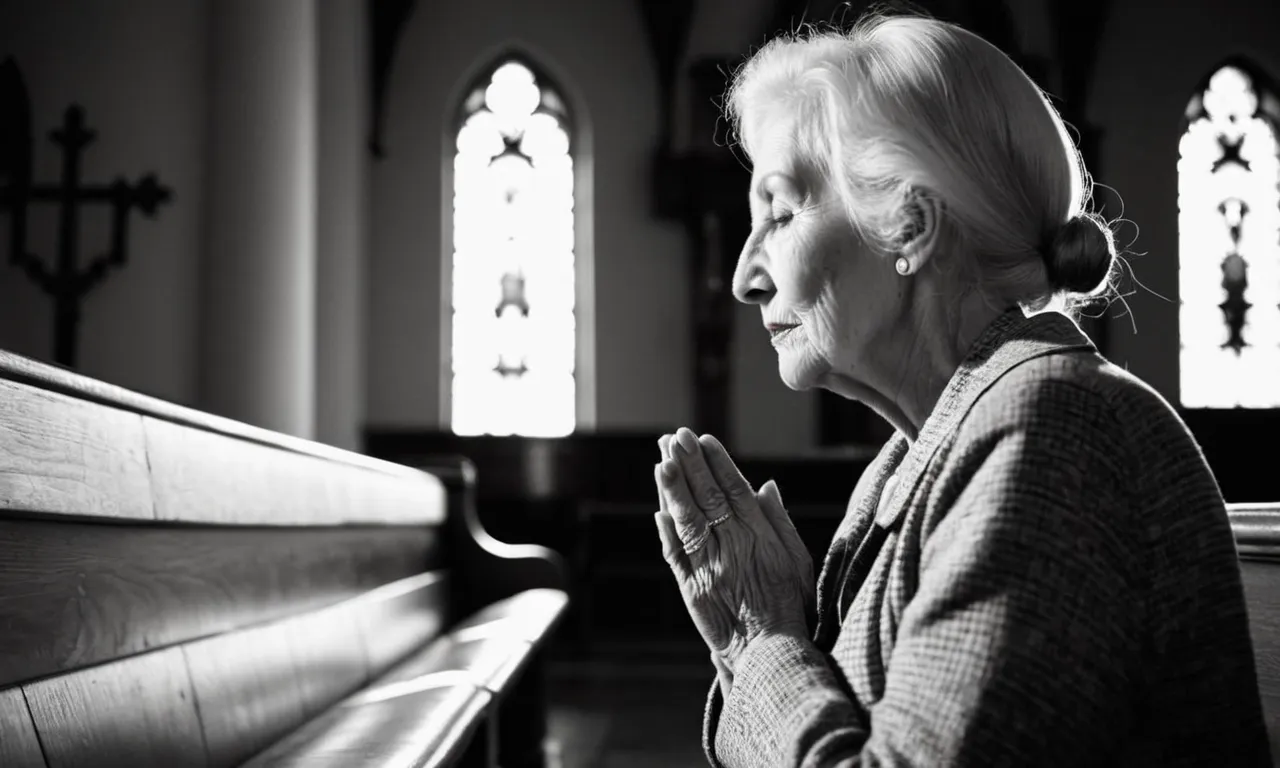 A black-and-white photo of a humble elderly woman praying in a dimly lit church, her hands clasped and face serene, capturing the essence of seeking righteousness and connection with God.