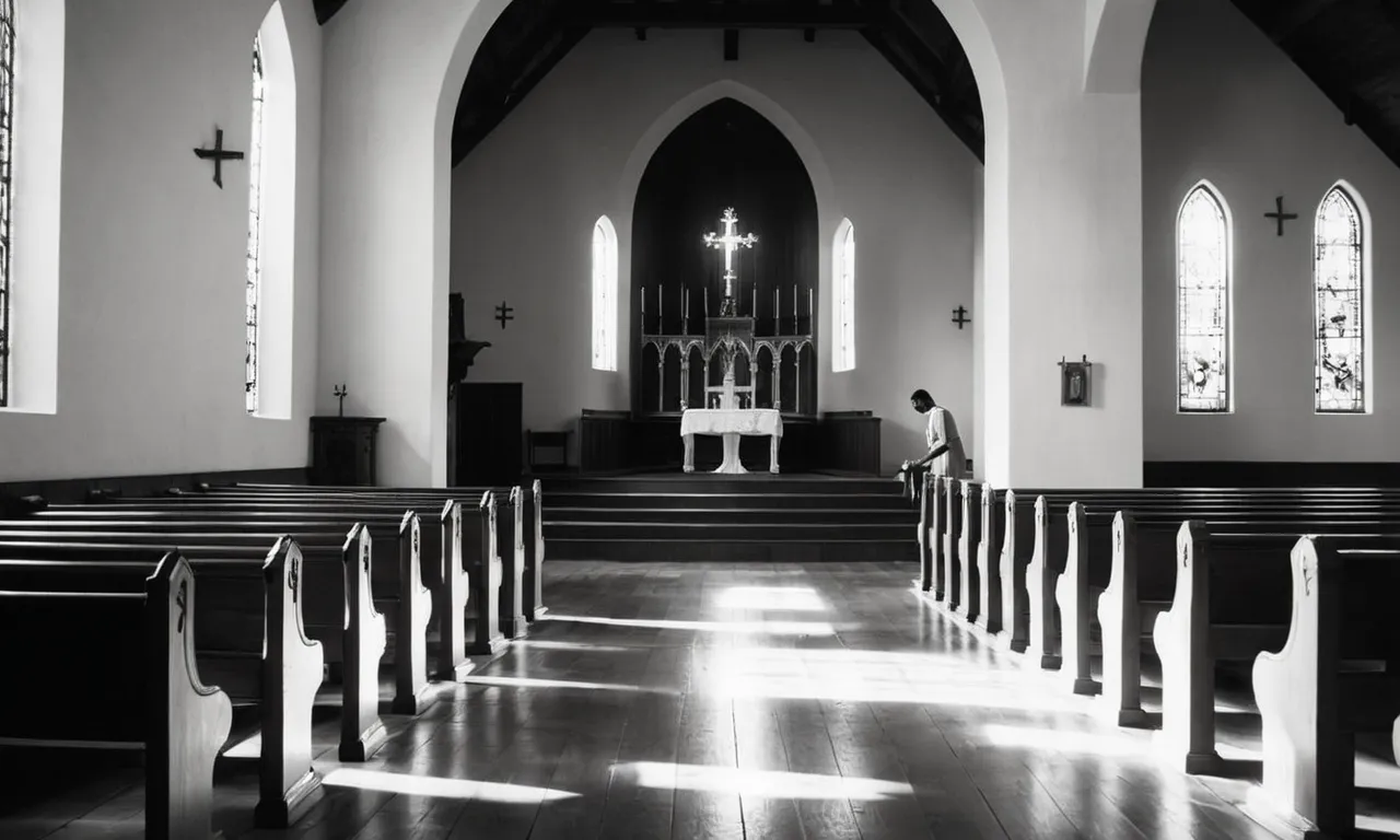 A serene black and white photo captures a solitary figure kneeling in a sun-drenched chapel, basking in the divine light, symbolizing the path to finding peace with God.