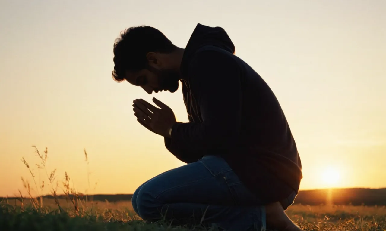 A photo capturing a serene sunset with a silhouette of a person kneeling in prayer, their hands clasped, eyes closed, and face bathed in warm golden light, symbolizing their deep focus on God.