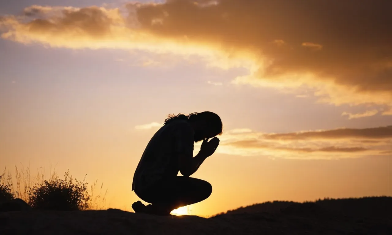 A photo capturing the silhouette of a person kneeling in front of a vibrant sunset, hands clasped in prayer, mirroring Jesus' humble devotion.
