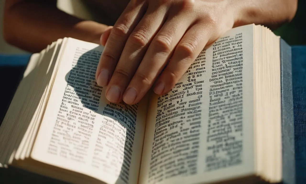 A close-up shot capturing a person's hands gently holding the "How to Pray with the 72 Names of God" PDF, illuminated by soft light, symbolizing the connection between spirituality and technology.