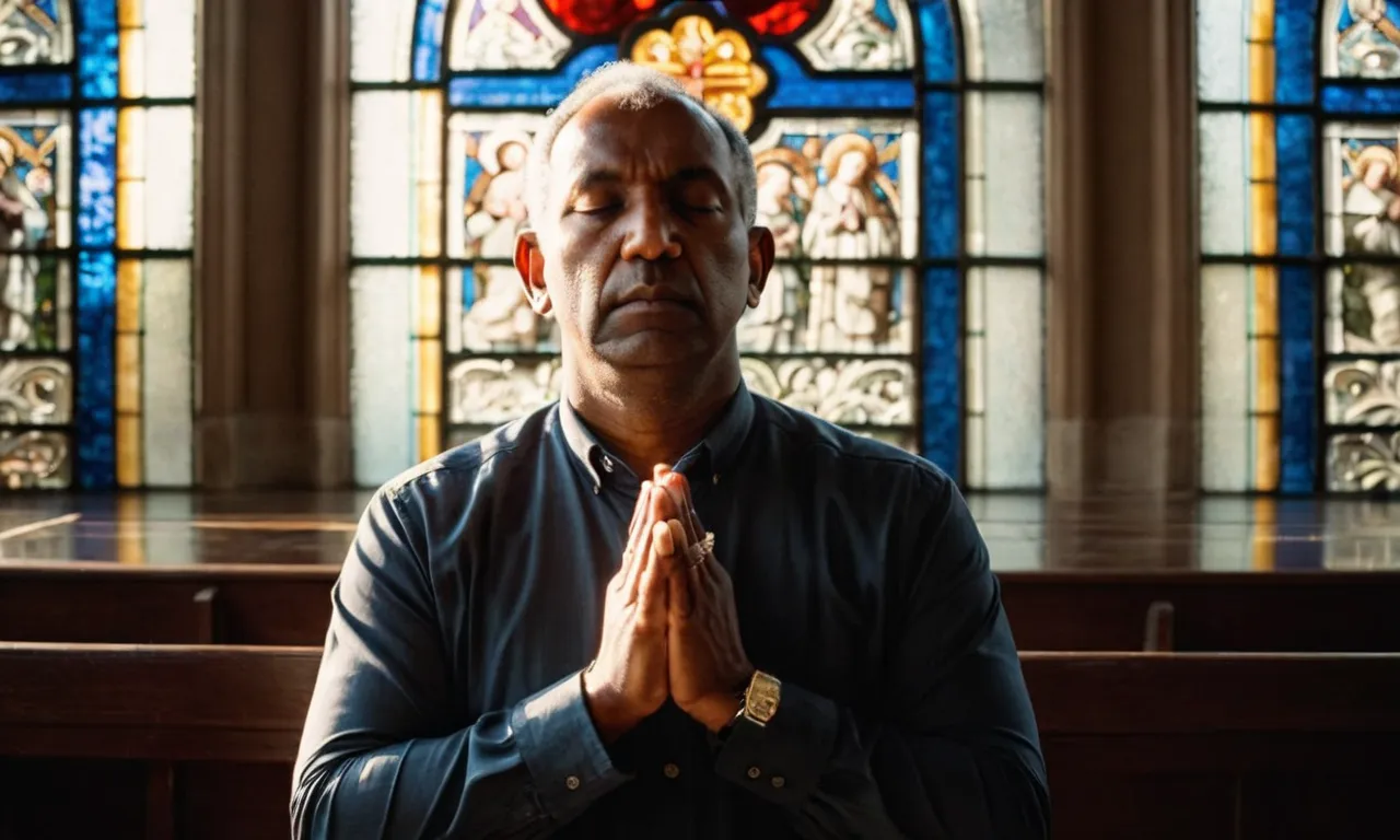A photo capturing a person deep in prayer, their eyes closed, hands clasped together, as rays of sunlight filter through a stained glass window, symbolizing the connection between the individual and God.