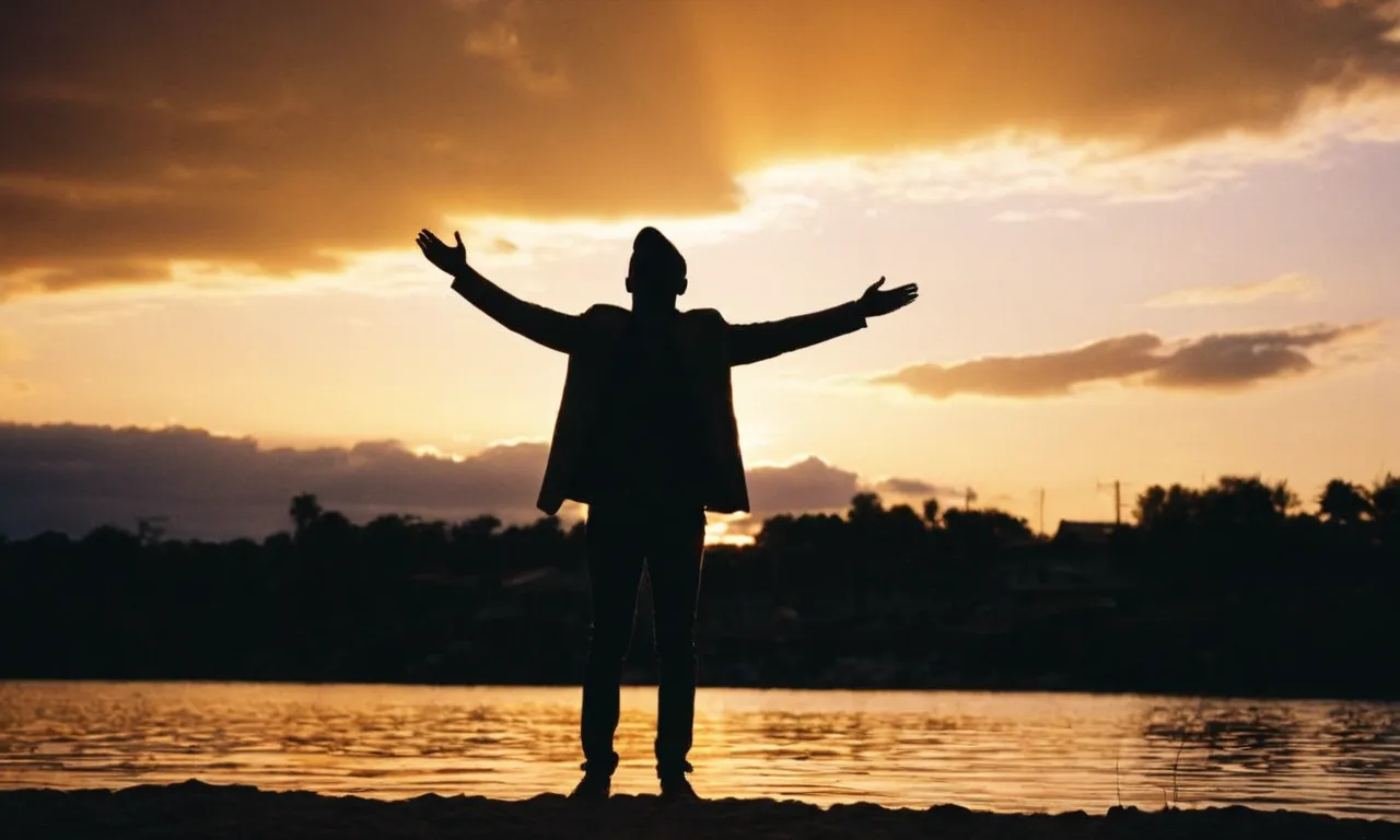 A silhouette stands tall against a vibrant sunset, arms outstretched, as rays of light envelop them, symbolizing their acceptance of their identity as defined by God's love and grace.