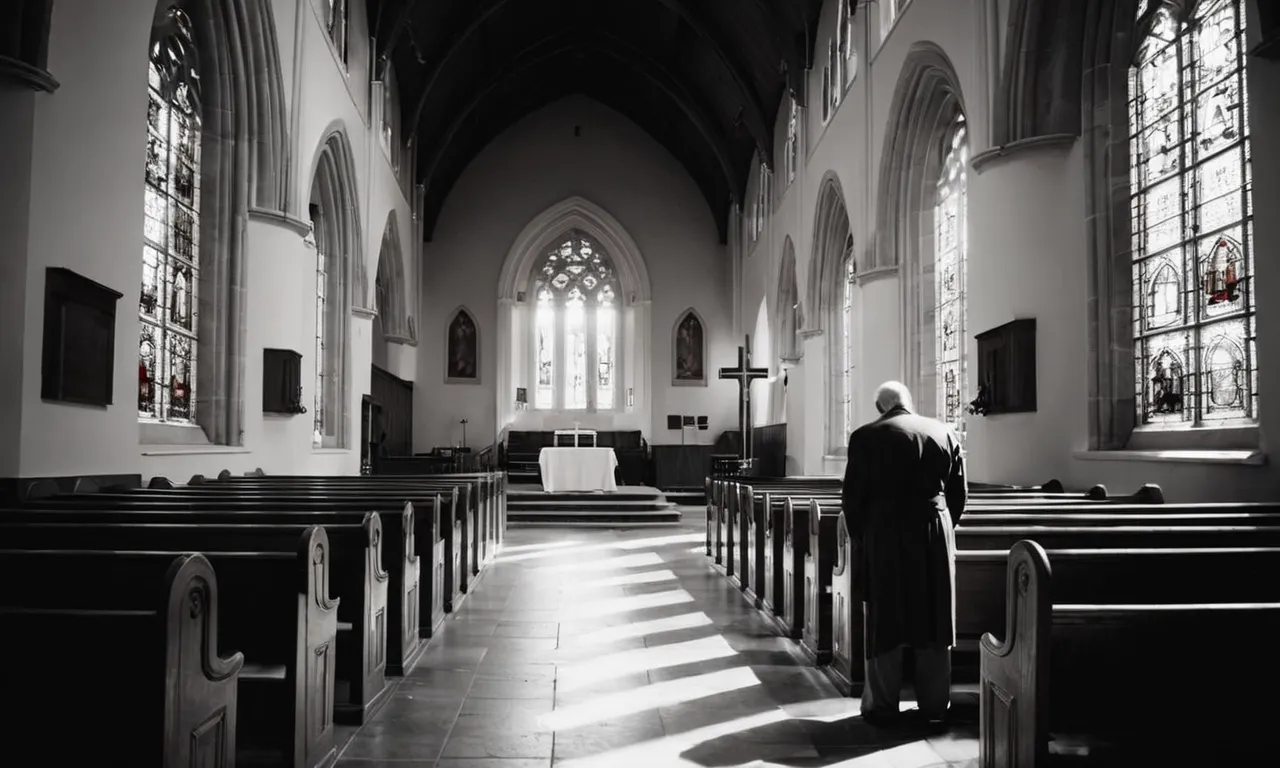 A black-and-white image of a solitary figure kneeling in a dimly lit church, captured from behind. Sunlight streams through stained glass, illuminating a vacant pew, symbolizing faith in God amidst silence.