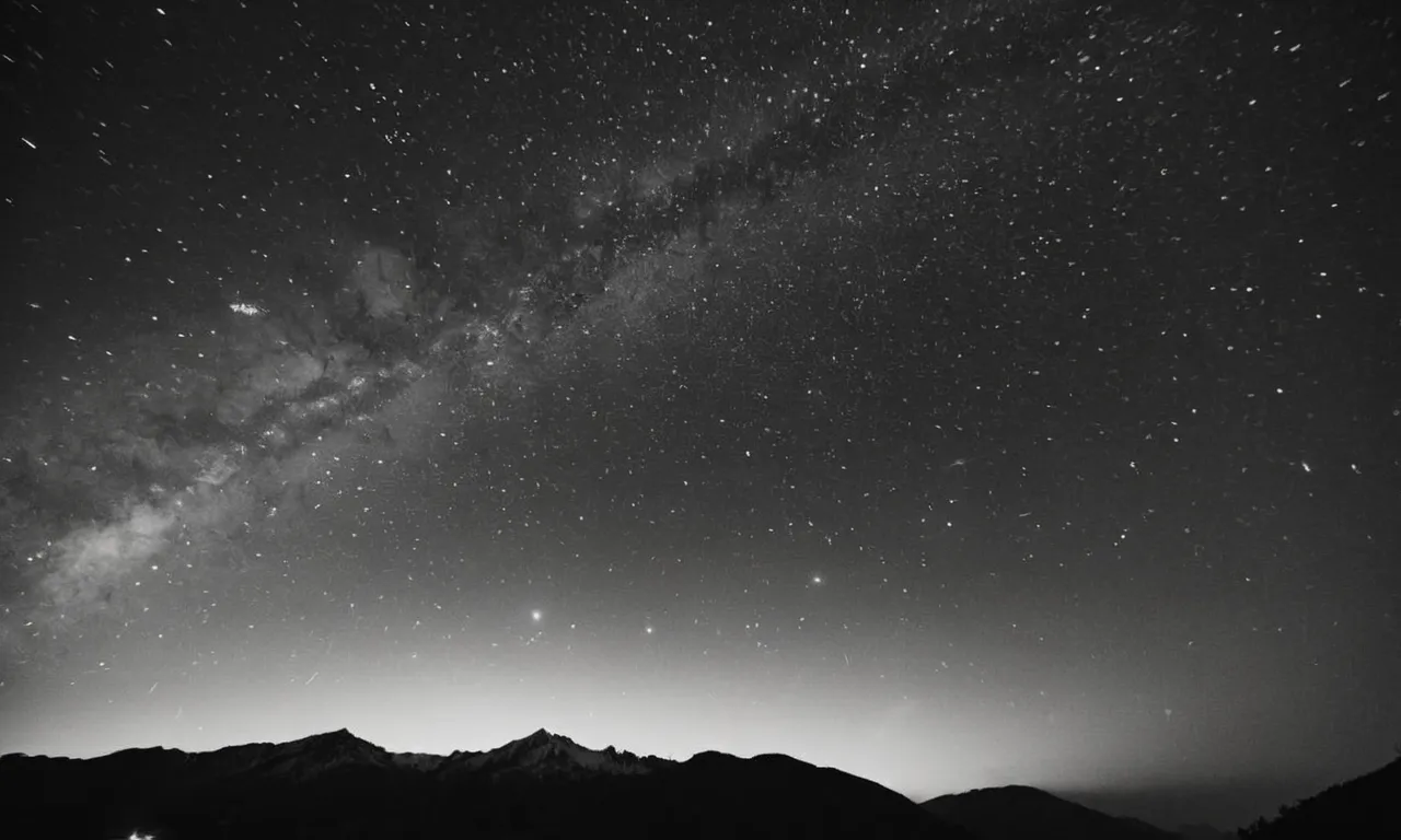 A captivating black and white photograph captures a mystic evening sky adorned with 72 illuminated stars, representing the enigmatic essence of the 72 names of God.