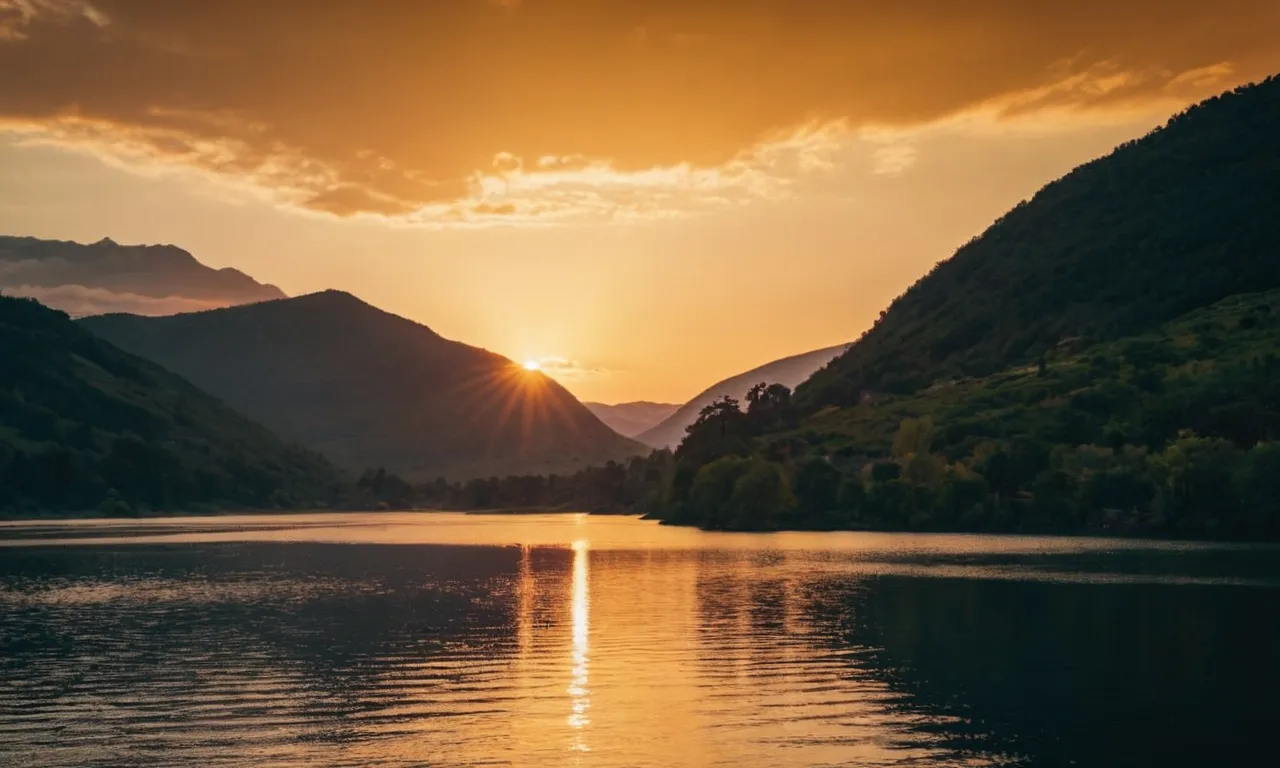 A photo showcasing a serene landscape with a golden sunset, symbolizing the principles of God - peace, harmony, and divine beauty.