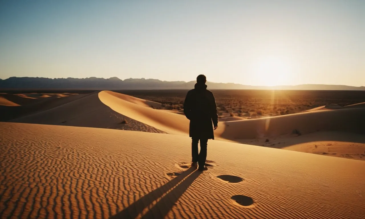 A captivating image of a person standing alone in a vast desert, their silhouette illuminated by a radiant sunset, symbolizing that nothing can separate us from the unconditional love of God.