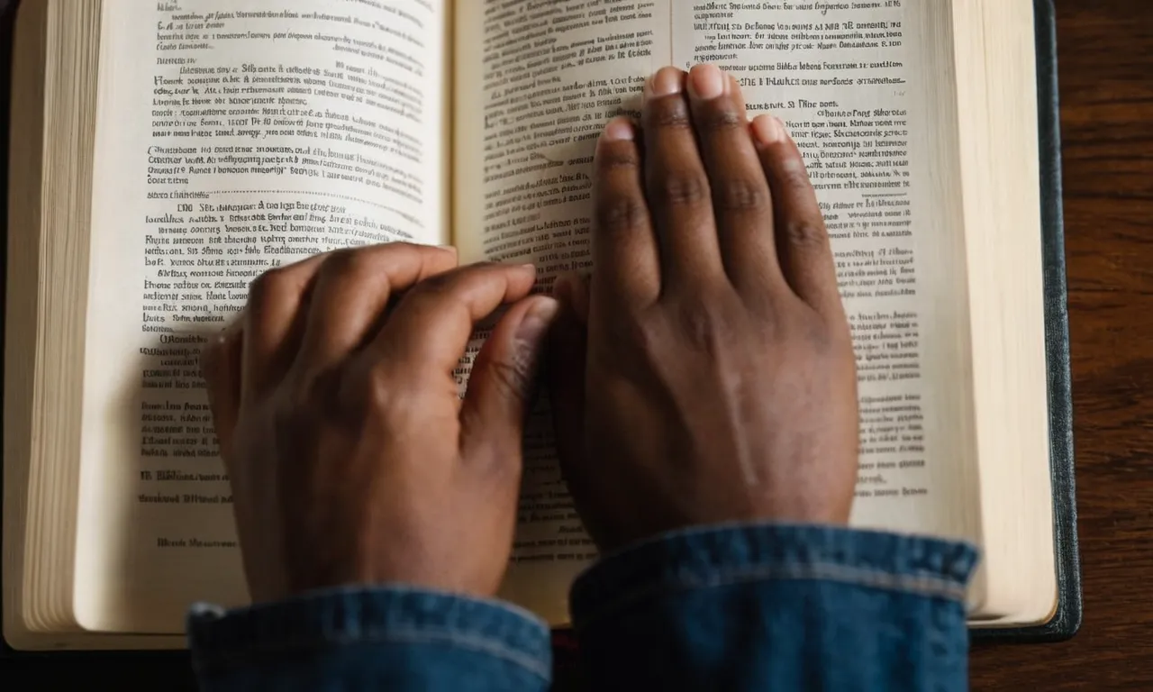 A close-up photo of a person's hands clasped in prayer, showcasing a Bible open to a page highlighting passages about confession and forgiveness.