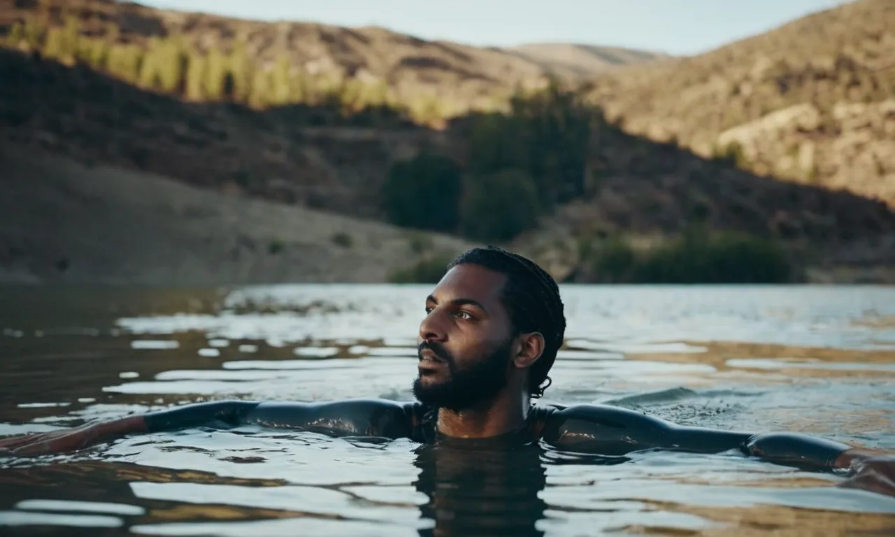 A photo capturing a person submerged in water, symbolizing baptism, represents deliverance in the Bible—a transformative act of salvation and liberation from sin.