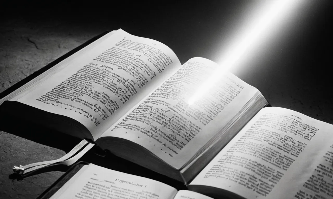A black and white photo of an open Bible with a spotlight illuminating the word "Jireh" on the page, symbolizing divine provision and God's faithful provision in times of need.