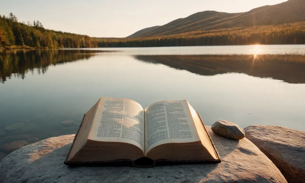 A photo of a tranquil lake at sunrise, with a Bible open on a nearby rock, capturing the essence of serenity as described in the Bible.