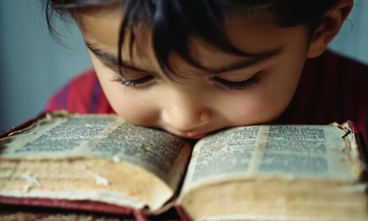 A photo capturing a child's tear-streaked face as they cling to a tattered Bible, seeking solace and guidance amidst the turmoil caused by neglectful or abusive parents.