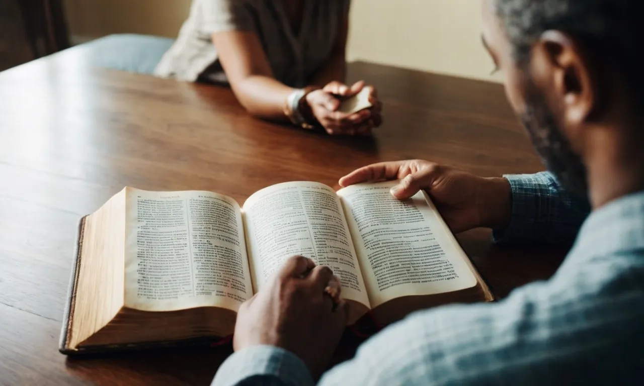 A photo capturing a person with an open Bible, attentively listening to another person, symbolizing the importance of biblical guidance and actively listening to others.
