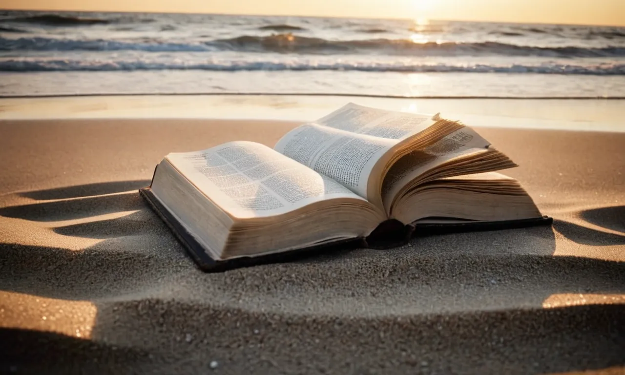 A black and white image of an open Bible lying on a deserted beach at sunset, symbolizing the uncertainty and contemplation surrounding the question of losing one's salvation.