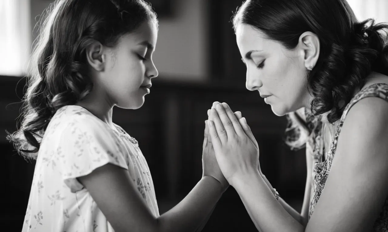 A tender black and white portrait captures a mother and daughter holding hands, their eyes closed in prayer, highlighting the spiritual bond and love rooted in biblical teachings.