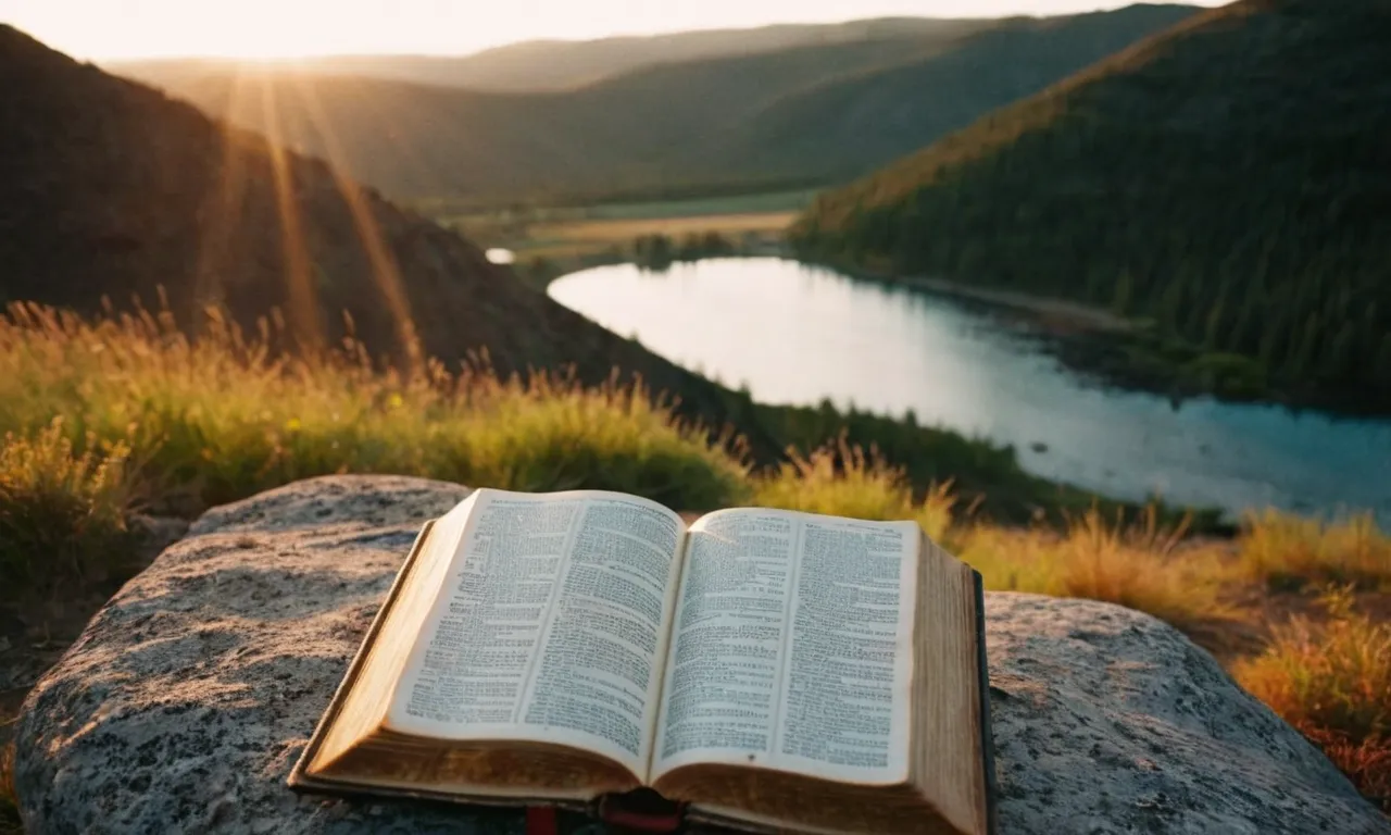 A photograph capturing a serene landscape at sunrise, with a worn-out Bible open on a rock, symbolizing the renewal of one's mind through the wisdom and teachings found within the scriptures.