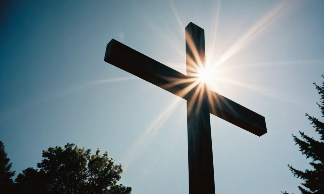 A captivating photo capturing the sun's radiant glow behind a cross, symbolizing the Bible's message of divine light and spiritual significance associated with the sun.