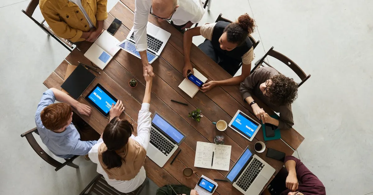 A photograph showing a diverse group of people, holding hands in unity and cooperation, symbolizing the biblical message of working together for a common goal.