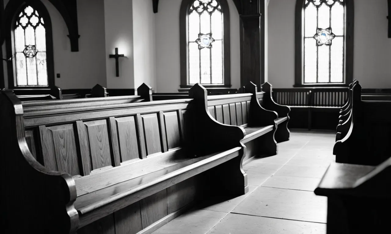 A black and white image capturing an empty church pew, bathed in dim light, symbolizing the absence of God's presence and challenging traditional notions of divinity.