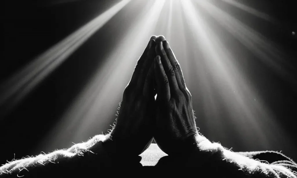 A black and white photo capturing humble hands clasped in prayer, illuminated by a single ray of sunlight, symbolizing a servant of God seeking guidance and surrendering to divine will.
