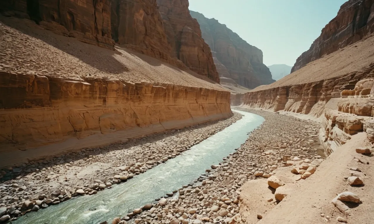 A stunning photograph capturing the serene beauty of a dry riverbed, known as a wadi, mentioned in the Bible. The image evokes a sense of ancient history and spirituality.