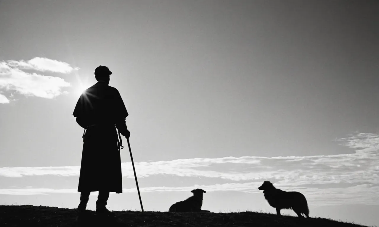 A black and white photo capturing a silhouette of a man standing on a hill, holding a shepherd's staff, symbolizing the biblical role of an overseer guiding and leading his flock.