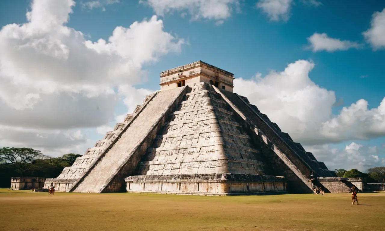 A photo capturing the majestic ruins of Chichen Itza, with the iconic pyramid of Kukulkan towering over the landscape, symbolizing the Mayan god of wind and learning.