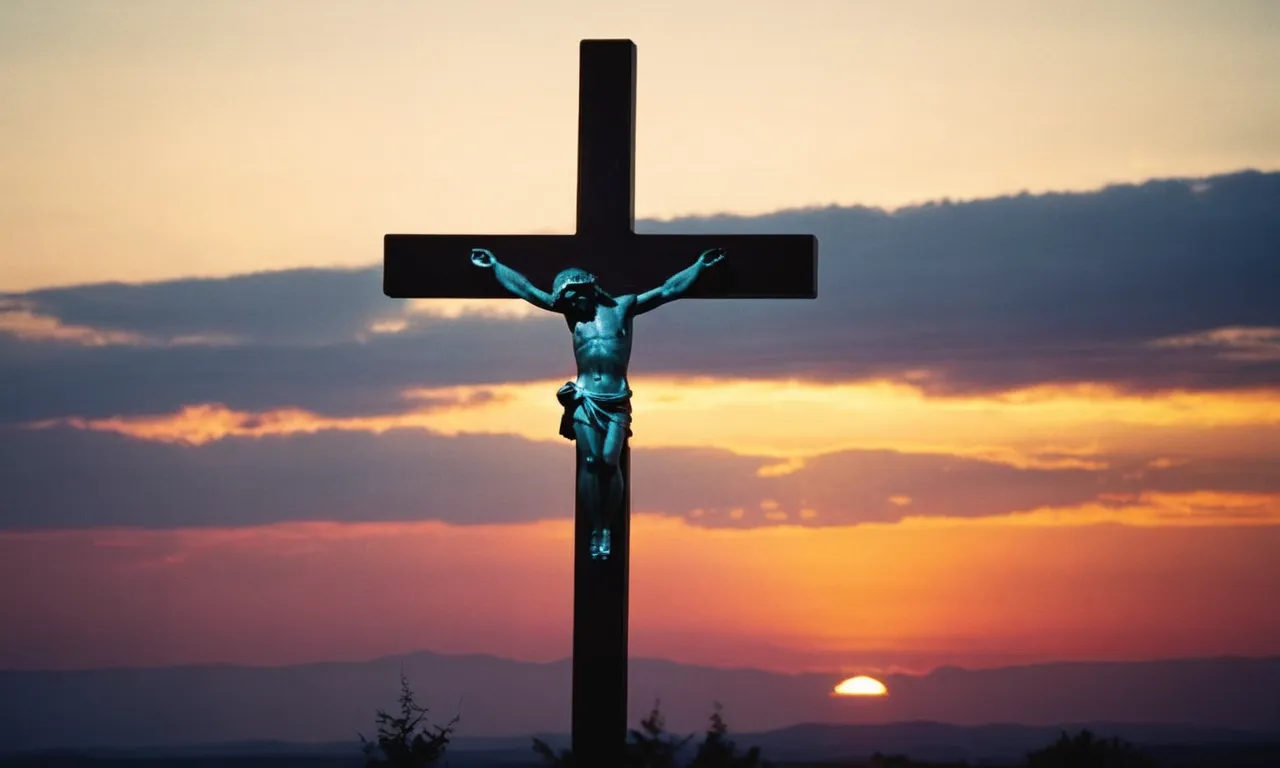 A photo showcasing a silhouette of a cross against a vibrant sunset, symbolizing the difference between God, the omnipotent creator, and Jesus, the divine incarnation and savior.