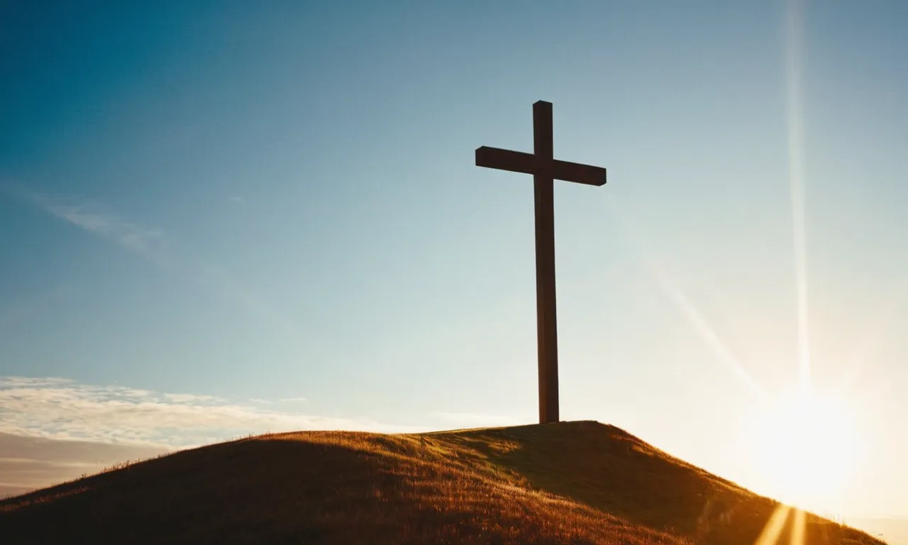 A photograph of a cross standing tall on a hill, bathed in golden sunlight, symbolizing the ultimate goal of Christianity - redemption, salvation, and eternal life through faith in Jesus Christ.