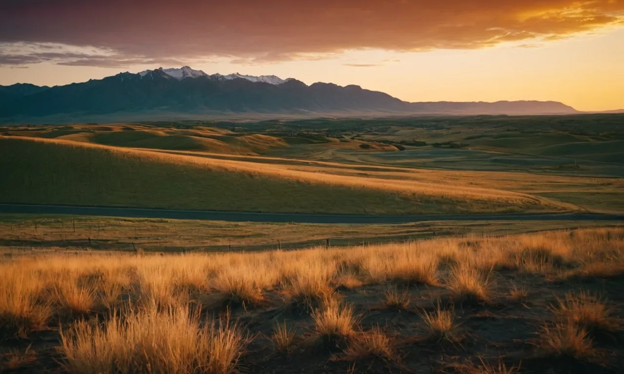 A photo of a serene sunset casting golden hues over a vast, untouched landscape, evoking a sense of awe and wonder, raising questions about the nature of God and our place in the universe.