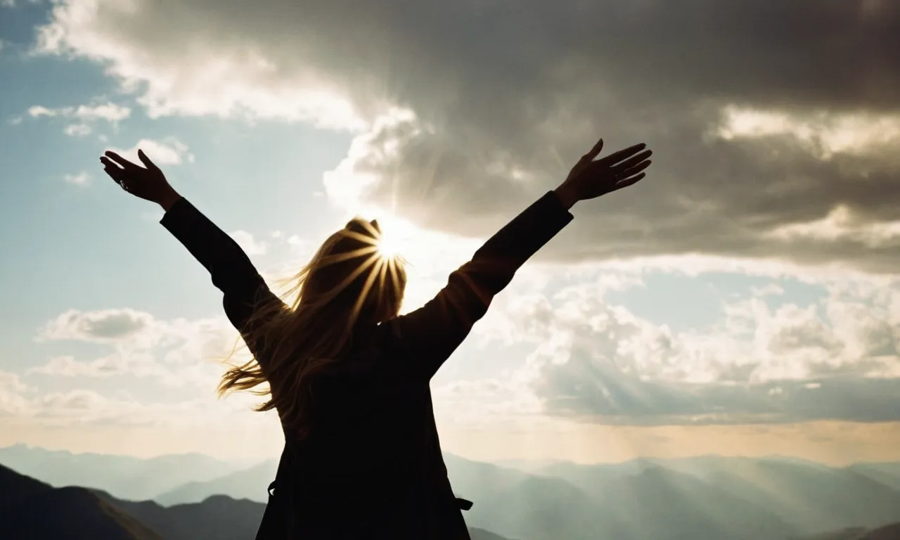 A silhouette of a person standing on a mountaintop, arms outstretched, as a golden sunbeam breaks through the clouds, symbolizing the divine presence and the standard of God.