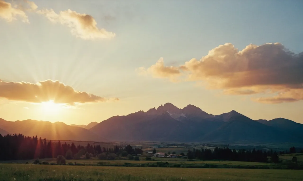 A breathtaking image captures a serene sunset over a mountain range, symbolizing divine protection. Rays of light beam down, illuminating the landscape, as if a heavenly force is shielding and guiding us.