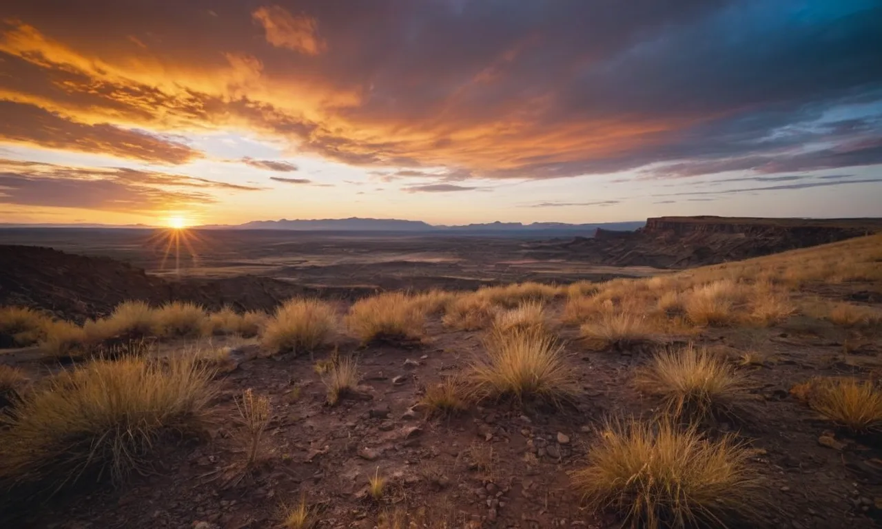 A breathtaking photo captures a barren land transformed by a vibrant sunrise, symbolizing the immense power of God's grace to bring beauty and renewal to even the most desolate circumstances.