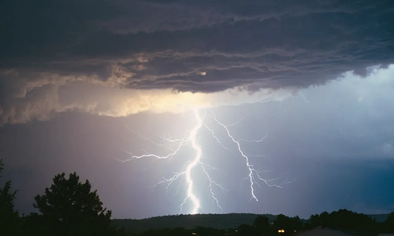 A photograph capturing a radiant beam of light piercing through a dark and stormy sky, symbolizing the divine covenant between God and Moses, representing guidance, protection, and divine intervention.