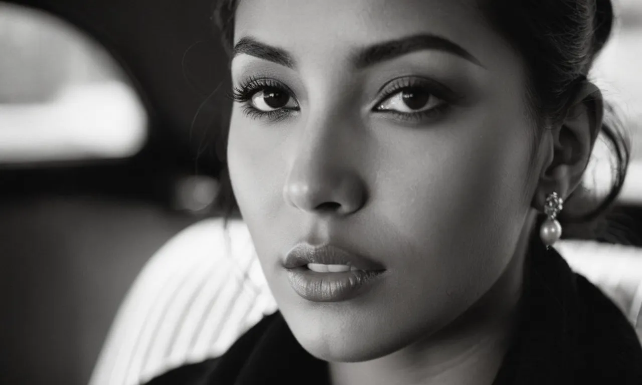 A breathtaking black and white portrait captures a soulful gaze, illuminating the subject's unique features, as if God himself breathed life into them, whispering "tada" with pride.