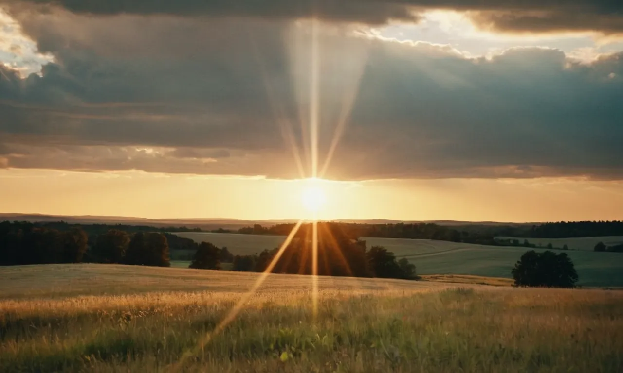 A breathtaking image captures a golden sunset over a serene landscape, as rays of light pierce through the clouds, revealing a heavenly figure, a profound moment when God reveals His presence.