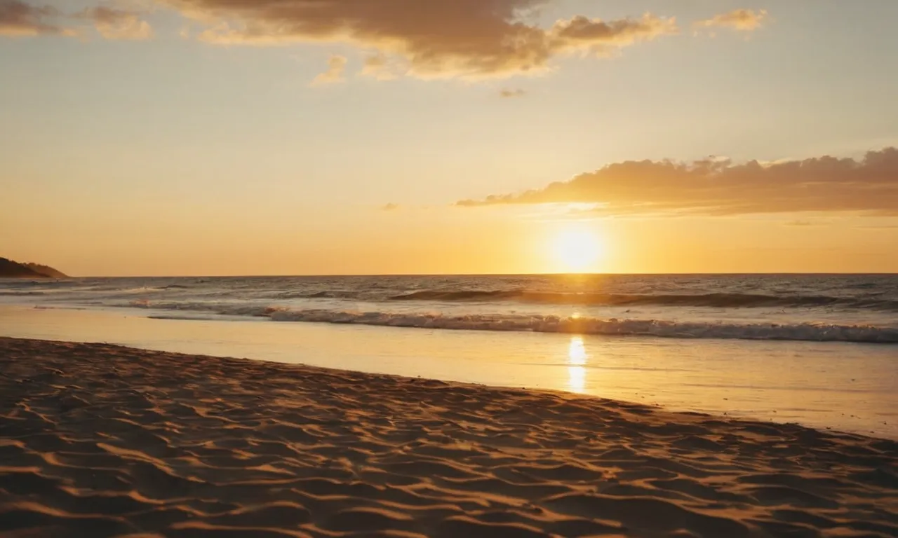 A photo capturing a serene, golden sunset over a tranquil beach, evoking the peacefulness and beauty that Jesus' goodness brings to mind.