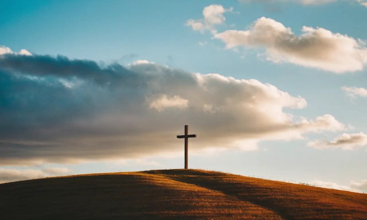 A photo capturing a solitary hilltop, bathed in golden light, with a rustic wooden cross standing tall against the vibrant sky, evoking a sense of mystery and spirituality.