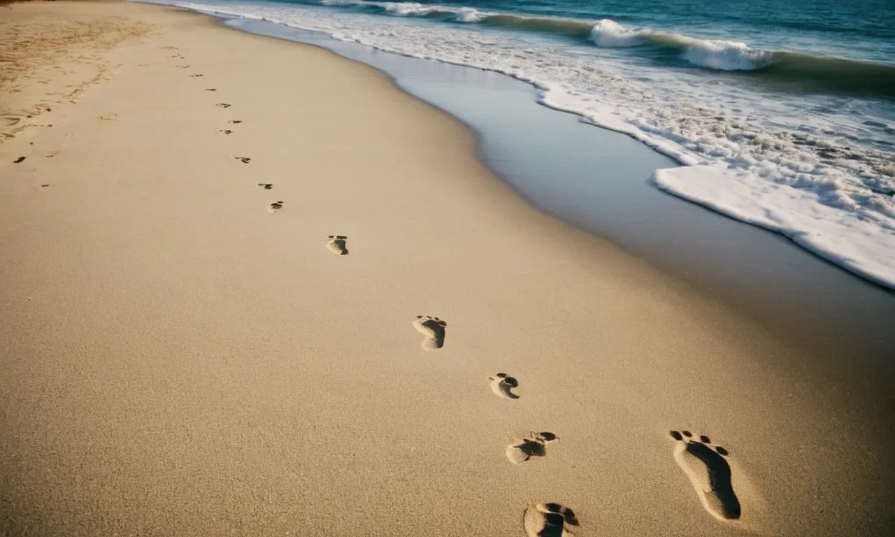 A photo captures two sets of footprints on a sandy beach, symbolizing unwavering loyalty and commitment, perfectly echoing the essence of the "where you go I will go" Bible verse.