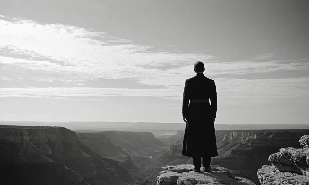 A captivating black and white image captures a solitary figure bathed in ethereal light, standing at the edge of a cliff, their outstretched arms reaching towards the heavens, seeking the answer to the age-old question - "Which angel is the voice of God?"