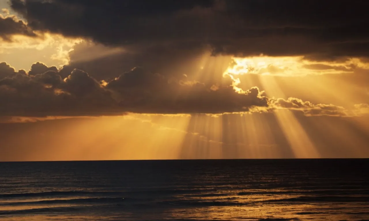 A photo of a serene sunset with golden rays shining through dark clouds, symbolizing the heavenly realm described in the Bible.