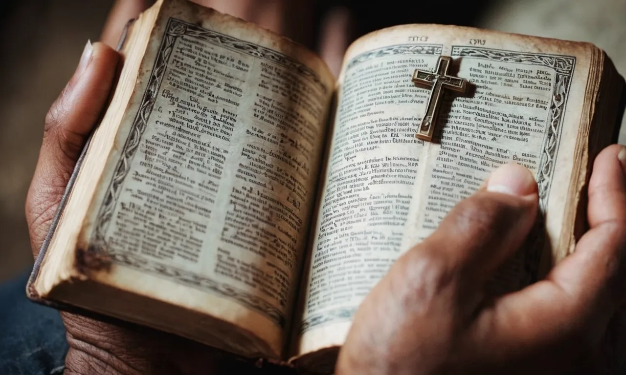 A close-up photo capturing the hands of a person holding a worn Bible, symbolizing their faith and connection to Christianity's leader.