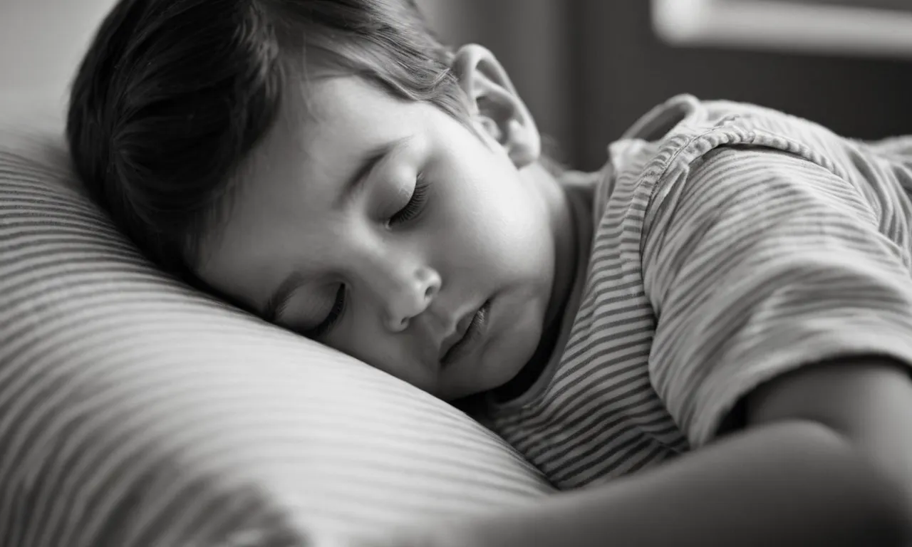 A black-and-white photo capturing the tender moment of a child peacefully sleeping in their father's arms, symbolizing the timeless bond of trust and protection found within the pages of the biblical narrative.