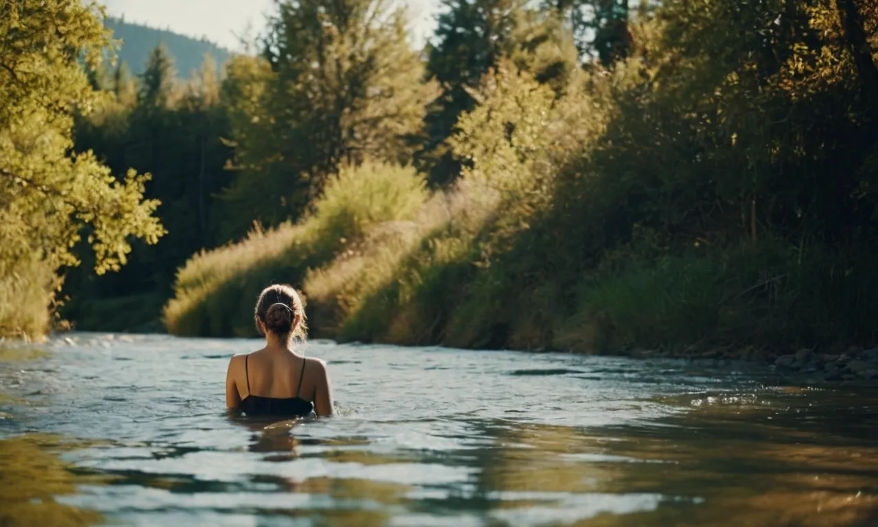 A photo of a serene riverbank, capturing the moment as a person emerges from the water, symbolizing their second baptism and spiritual rebirth, surrounded by a peaceful ambiance.