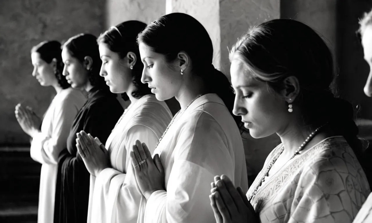 A black and white photo captures a serene moment, showing a group of women in prayer, symbolizing the search for the identity of the first woman apostle in the Bible.